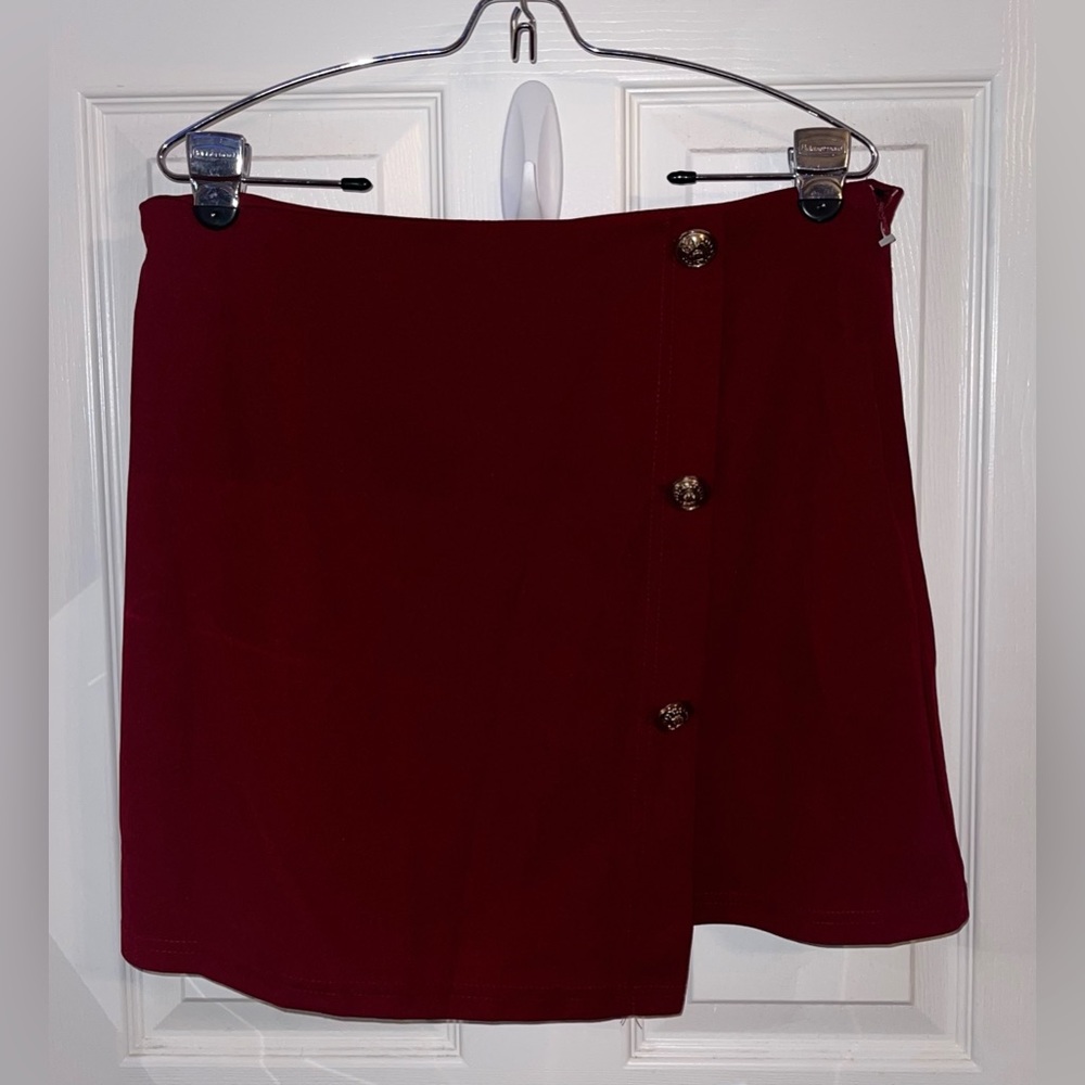 reddish/burgundy miniskirt with fake buttons